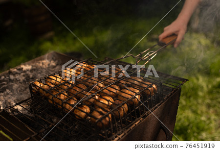 mushrooms champignons stacked in a barbecue on the grill mushrooms champignons stacked in a barbecue on the grill 76451919