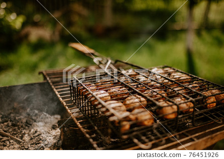 mushrooms champignons stacked in a barbecue on the grill mushrooms champignons stacked in a barbecue on the grill 76451926