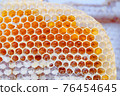 Fresh honey in honeycombs 76454645