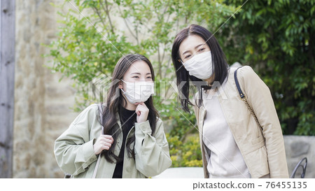 Two women going out Two women going out 76455135