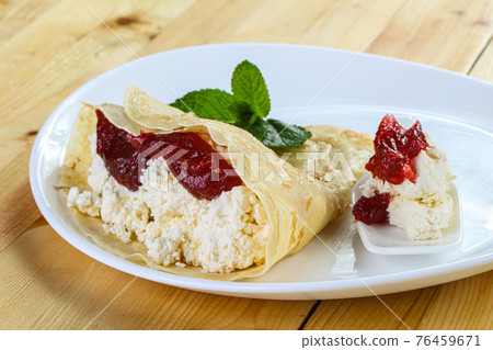 Pancake with cottage cheese and jam Pancake with cottage cheese and jam 76459671
