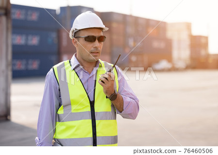 Foreman control loading Containers box from Cargo freight ship for import and export, transpor Foreman control loading Containers box from Cargo freight ship for import and export, transpor 76460506