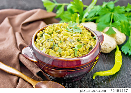 Kitchari in bowl on dark board 76461387