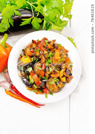 Ragout with eggplant and pepper on light board top Ragout with eggplant and pepper on light board top 76461619