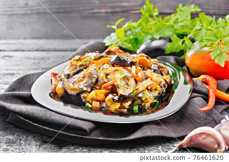 Ragout with eggplant and pepper on black board Ragout with eggplant and pepper on black board 76461620