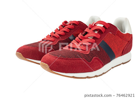 Red sneakers isolated on white background. Casual style. Red sneakers isolated on white background. Casual style. 76462921