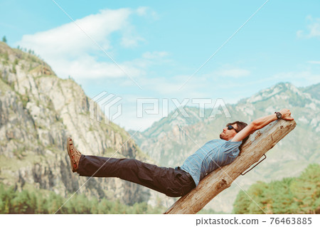 the guy is fooling around in nature 76463885