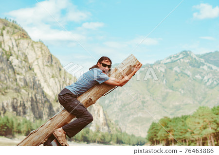 the guy is fooling around in nature the guy is fooling around in nature 76463886