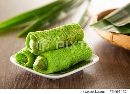 Malaysia popular sweet dessert with coconut known as kuih ketayap Malaysia popular sweet dessert with coconut known as kuih ketayap 76464462