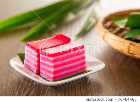 Kuih lapis is a traditional Malay nyonya sweet desert on wooden table 76464466