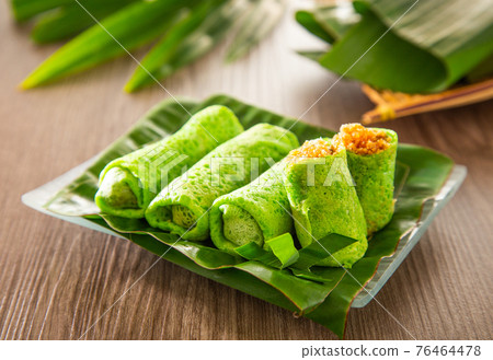 Malaysia popular sweet dessert with coconut known as kuih ketayap Malaysia popular sweet dessert with coconut known as kuih ketayap 76464478