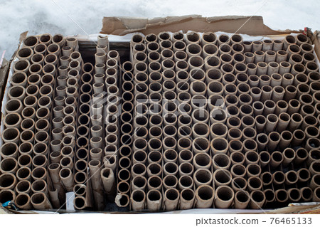 Used fireworks firecrackers pack on street. Human impact on the environment. Environmental pollution 76465133