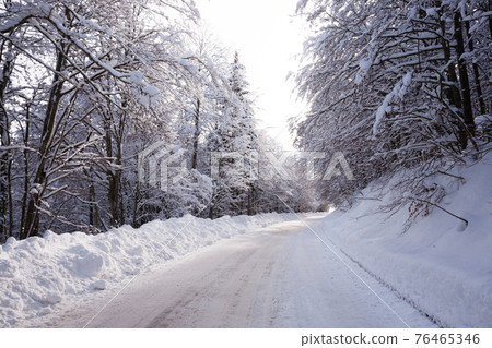 Winter landscape, road covered by snow 76465346
