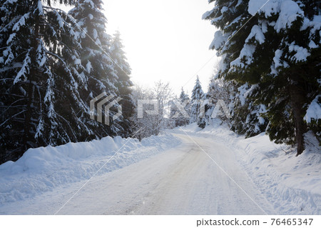 Winter landscape, road covered by snow 76465347