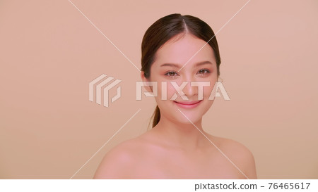 Beautiful face of Asian young woman with natural skin. Beautiful face of Asian young woman with natural skin. 76465617