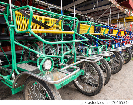 Italian bicycle rickshaws for walking in the park 76465844