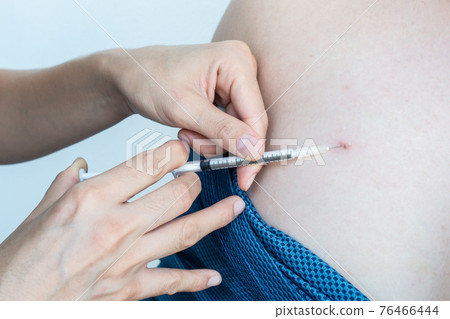 Close up of doctor hand injection Antibiotics to patient skin for treat skin abscesses. Antibiotics are used to treat or prevent some types of bacterial infection. 76466444