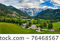 Aerial view of Alpine valley with farmhouse in Jezersko, Slovenia 76468567