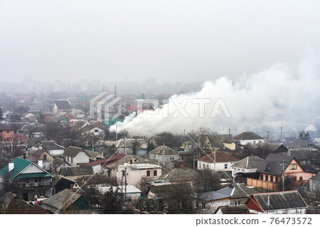 Top view of the area in which a residential building is on fire. Fire in the private housing sector 76473572