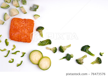 Handmade frozen semi-finished vegetable preparation. Chopped vegetables for quick cooking Handmade frozen semi-finished vegetable preparation. Chopped vegetables for quick cooking 76473576