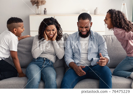 Angry black children fighting over their shocked parents 76475229