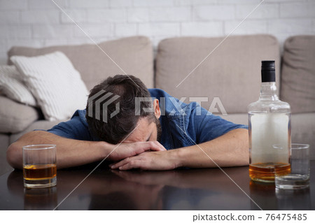 Alcoholism, addiction, weakness and drinking whiskey alone 76475485