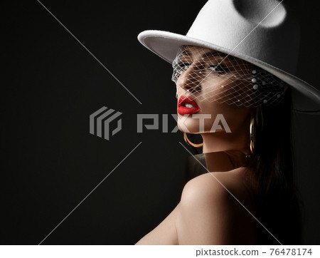 Portrait of rich gorgeous woman in wide-brimmed Portrait of rich gorgeous woman in wide-brimmed 76478174