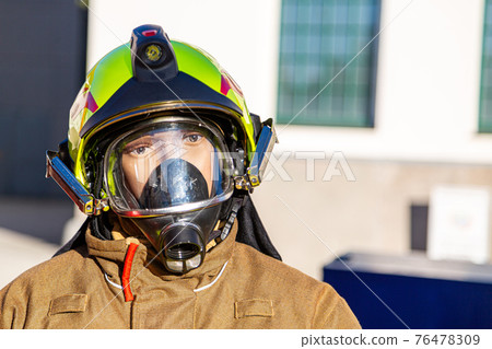 Male mannequin wearing a fire fighter uniform Male mannequin wearing a fire fighter uniform 76478309