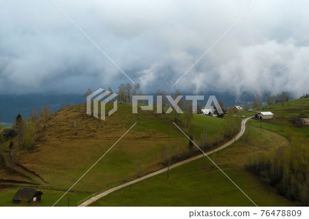 Clouds over the Carpathian Mountains, near Magura Village, Transylvania, Romania. 76478809
