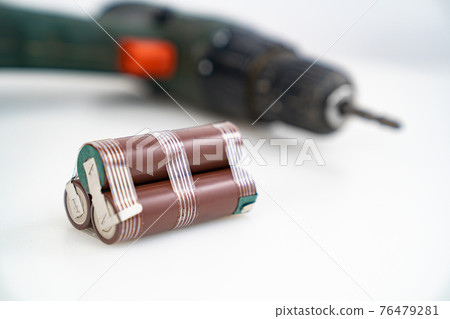 Replacing battery pack in screwdriver with new ones. Focus on battery assembly Replacing battery pack in screwdriver with new ones. Focus on battery assembly 76479281