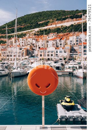 A close-up of a lifebuoy box on a yacht dock at Lustica Bay in Montenegro. 76479521