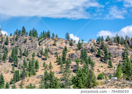 Mountain landscape with residential houses on hot summer day Mountain landscape with residential houses on hot summer day 76480050