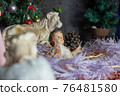 Christmas crib built in the garden of a house 76481580