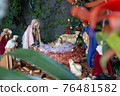 Christmas crib built in the garden of a house 76481582