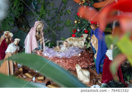 Christmas crib built in the garden of a house Christmas crib built in the garden of a house 76481582