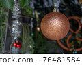 Single christmas ball decoration on a crib 76481584