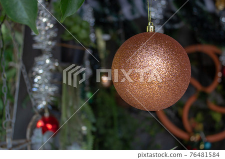 Single christmas ball decoration on a crib 76481584