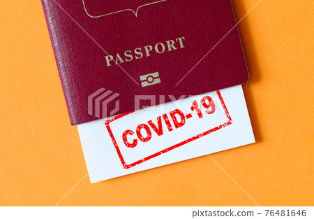 Travel and coronavirus concept, COVID-19 stamp in tourist passport Travel and coronavirus concept, COVID-19 stamp in tourist passport 76481646