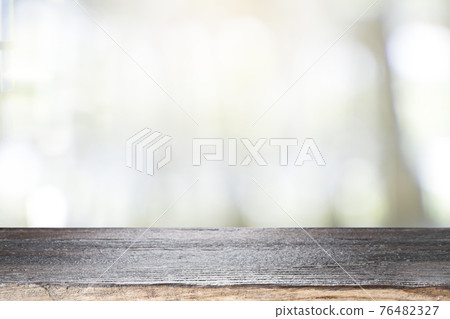 Empty wooden table for present product on coffee shop blur background. 76482327