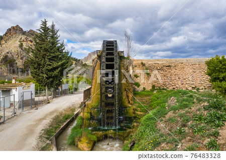 Ancient arabic mill, water noria at Abaran village in Murcia region Spain Europe Ancient arabic mill, water noria at Abaran village in Murcia region Spain Europe 76483328