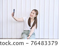 Closeup portrait of Asian lady smile and taking selfie at her home. Concept woman lifestyle 76483379
