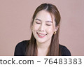 Beautiful Asian lady close her eyes and smile. Concept woman lifestyle 76483383