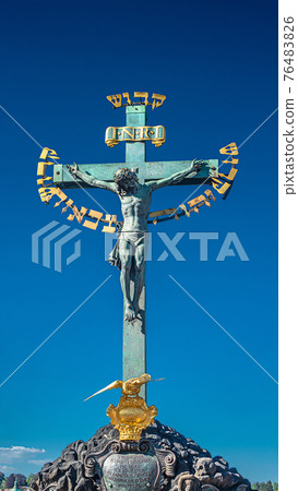 Statue of Crucifixion of Jesus at the Charles Bridge in Prague, Czech Republic Statue of Crucifixion of Jesus at the Charles Bridge in Prague, Czech Republic 76483826