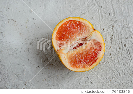 Half of a pink grapefruit Half of a pink grapefruit 76483846