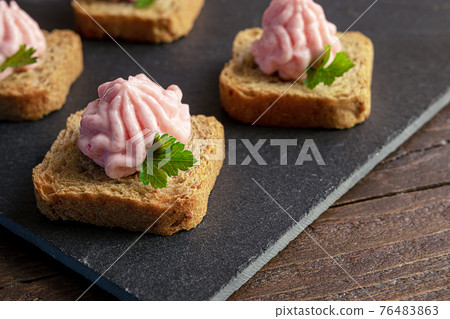 Tarama snacks on a slate board Tarama snacks on a slate board 76483863