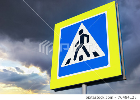 Road sign Pedestrian Crossing with clouds 76484125