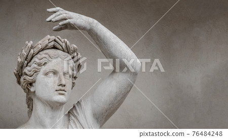 Statue of sensual Roman renaissance era woman in circlet of bay leaves, Potsdam, Germany, details, closeup 76484248