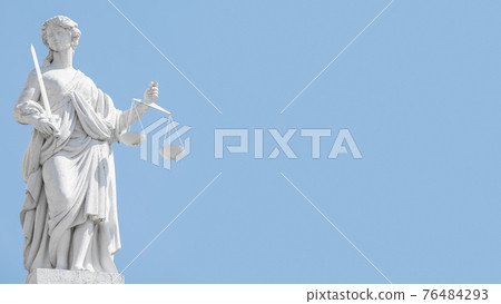 Statue a judge woman with scales and sword at blue sky in Potsdam, Germany Statue a judge woman with scales and sword at blue sky in Potsdam, Germany 76484293
