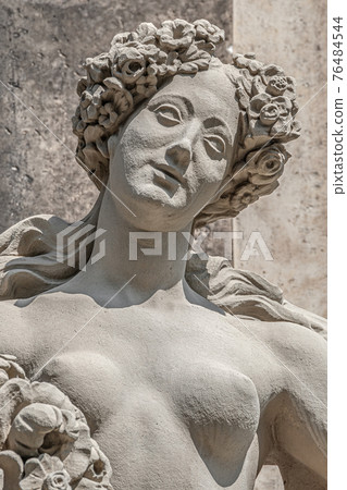 Old statue of a sensual Baroque era naked woman at the main Kronentor gateway to the Zwinger palace and garden in downtown of Dresden, Germany, details, closeup 76484544
