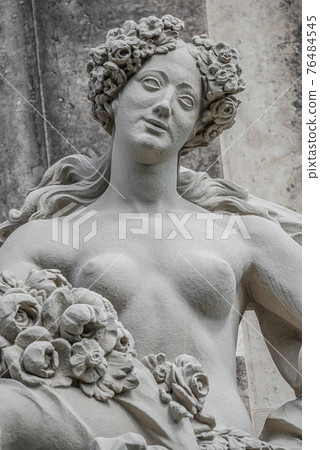 Old statue of a sensual Baroque era naked woman at the main Kronentor gateway to the Zwinger palace and garden in downtown of Dresden, Germany, details, closeup 76484545